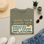 T‑Shirt — "Loaves, Fish & Budget Cuts: Miracles Don’t Cover Inflation"