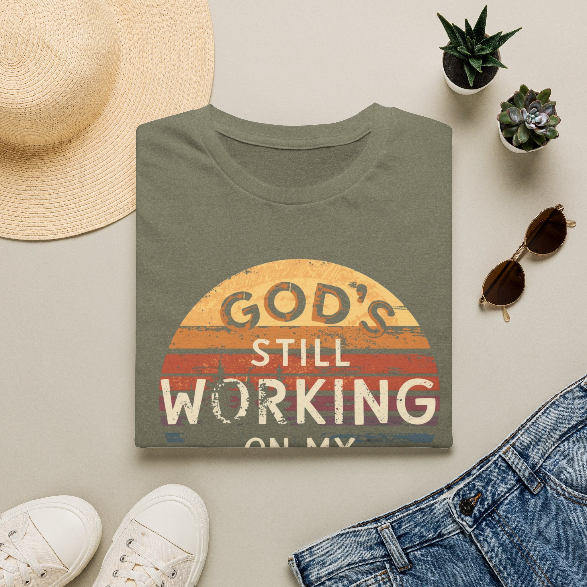 Christian T-Shirt — "God’s Still Working on My Attitude" Retro Sun Graphic